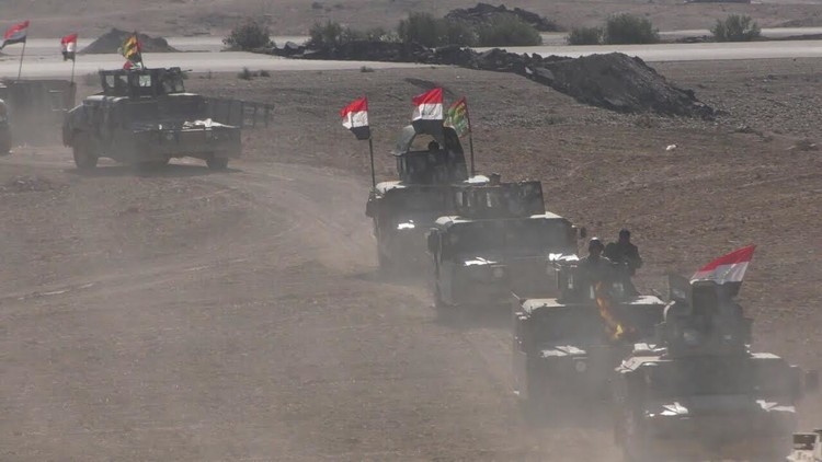 الجيش العراقي يرفع العلم في آخر بلدة تفصله عن الموصل جنوبا