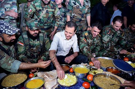 Updated-President al-Assad partakes in Iftar with heroes of the army in Marj al-Sultan Airport