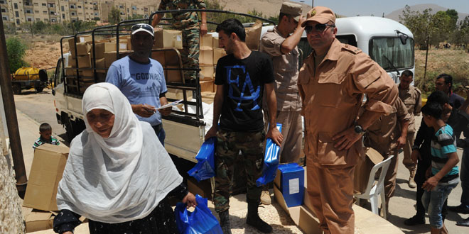 Russian humanitarian aid distributed to displaced families in al-Dwair area in Damascus Countryside