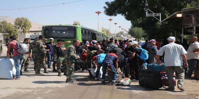 Updated-303 people from Daraya transported from al-Moaddamiyeh to Harjalleh makeshift center